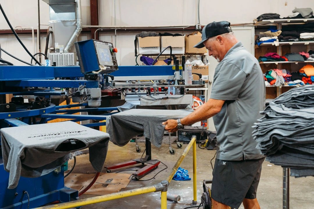 Southern Tees team screen printing apparel in the Conway workshop